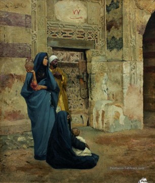 Une famille à la porte près de l’entrée Ludwig Deutsch Orientalism Peinture à l'huile